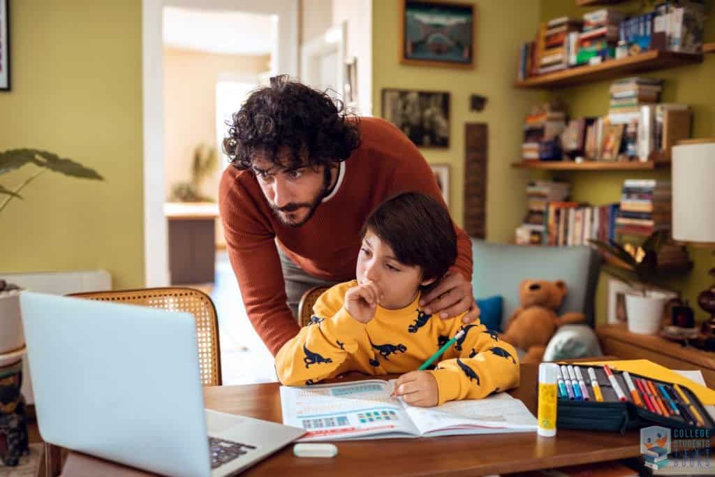 Close up of a father helping his son with schoolwork